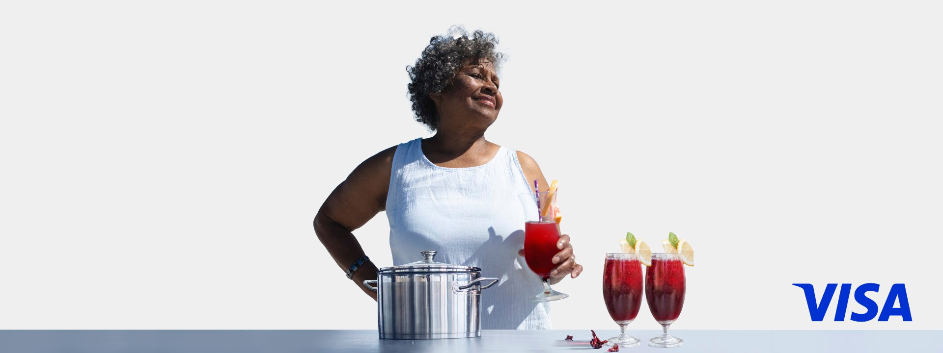 A woman holding a drink in her hand